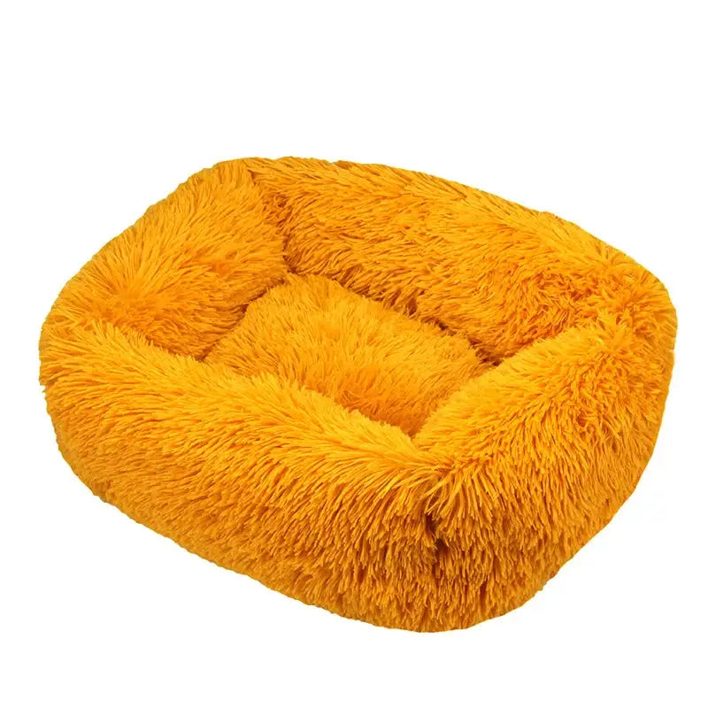 Fluffy, bright yellow pet bed with plush, shaggy texture.