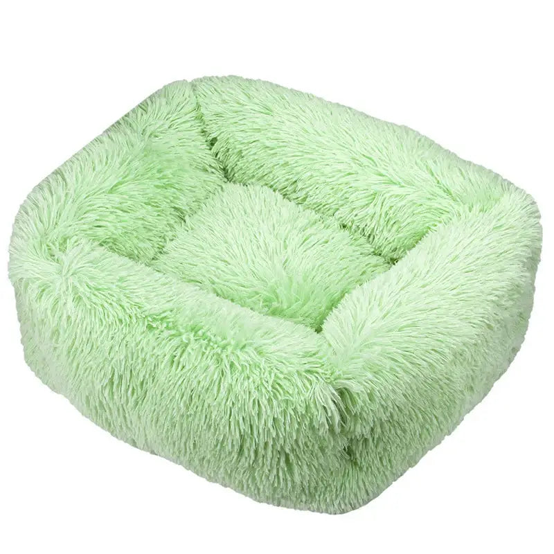 Fluffy, light green pet bed with a plush, shaggy texture.