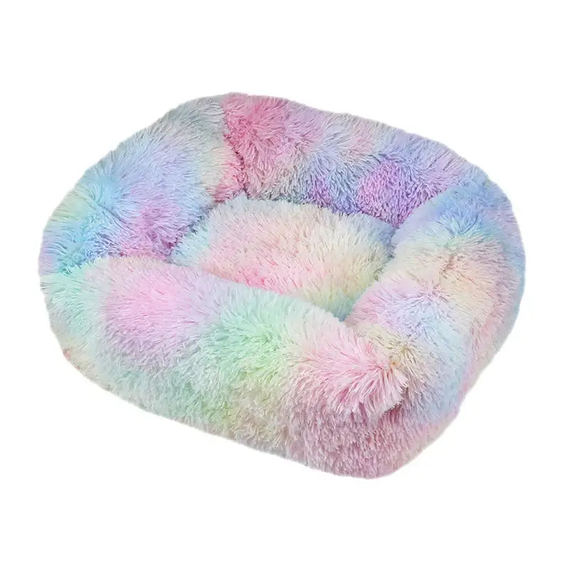 Fluffy, pastel-colored pet bed with a circular shape and plush texture.