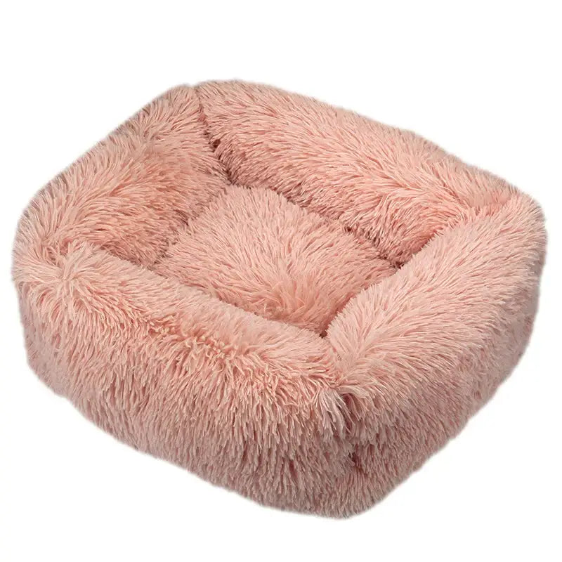 Fluffy pink square pet bed with raised edges.