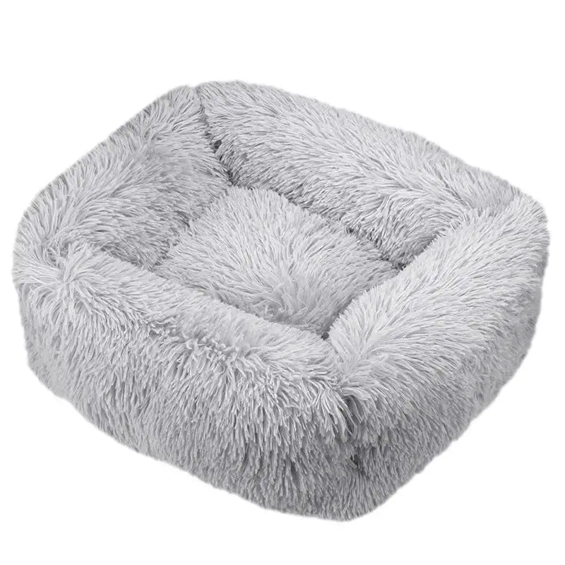 Fluffy, square-shaped pet bed with plush gray fur lining.