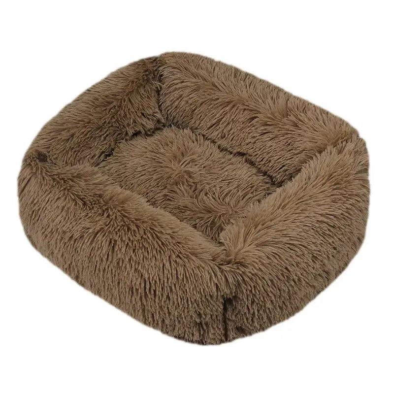 Fluffy, square-shaped pet bed with raised edges in a light brown color.