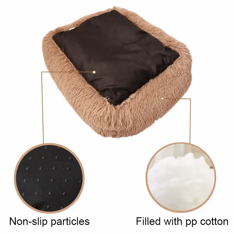 Plush pet bed with a dark cushion and fluffy tan edges.