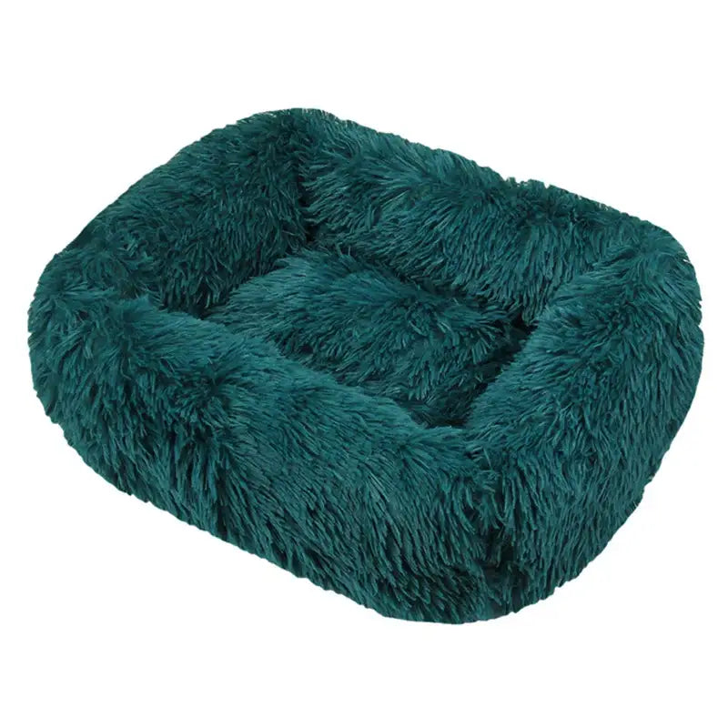 Plush, teal-colored pet bed with fluffy, shaggy texture.