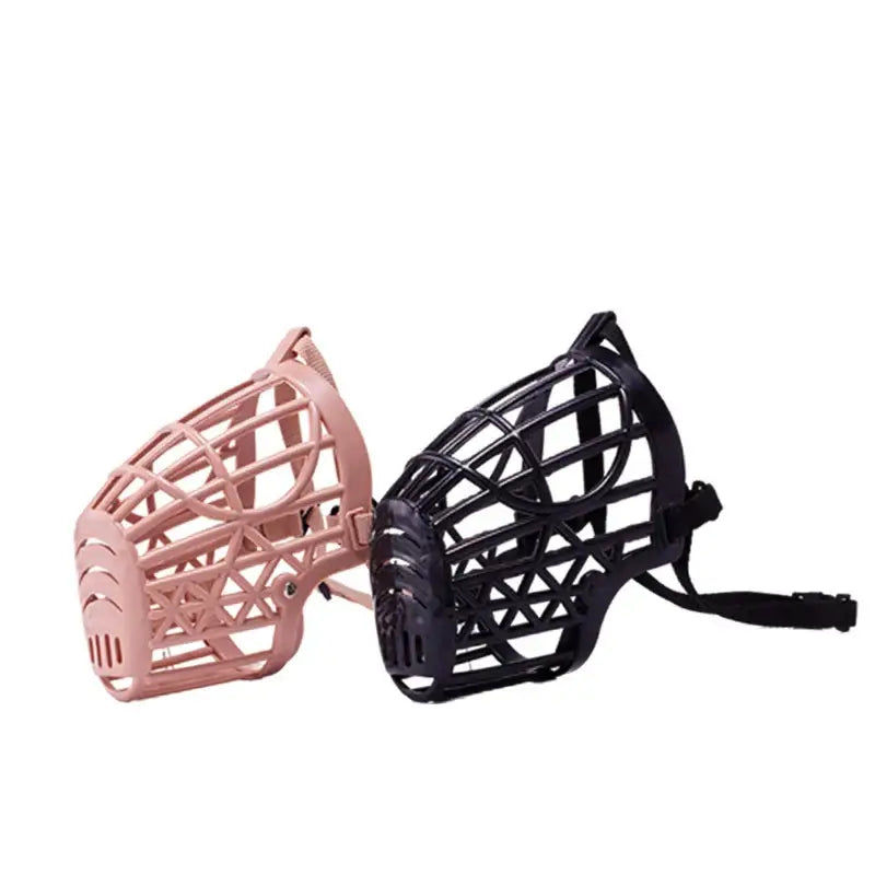 Two plastic dog muzzles, one pink and one black, with lattice-like designs.