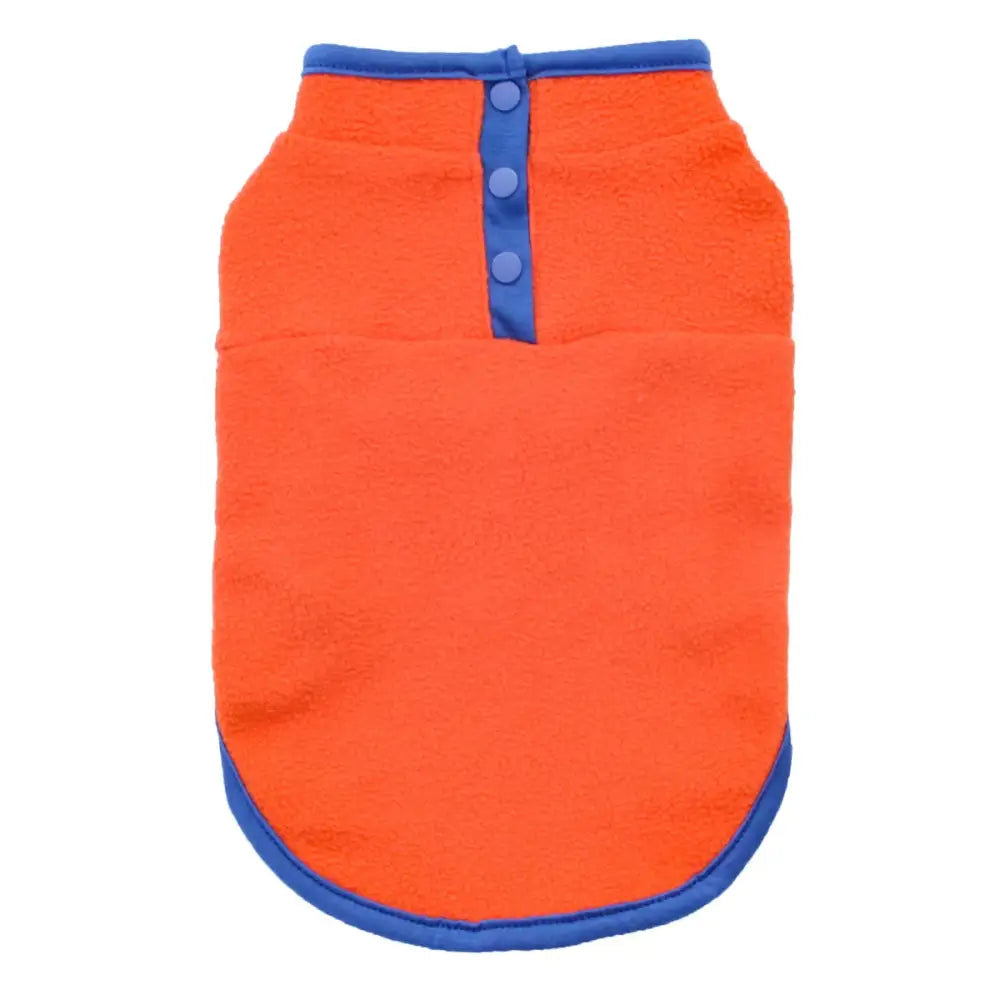 Bright orange dog shirt with blue trim and buttons.