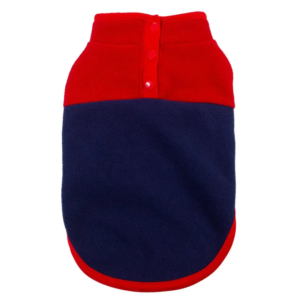 Two-toned dog sweater with a red top half and navy blue bottom half.