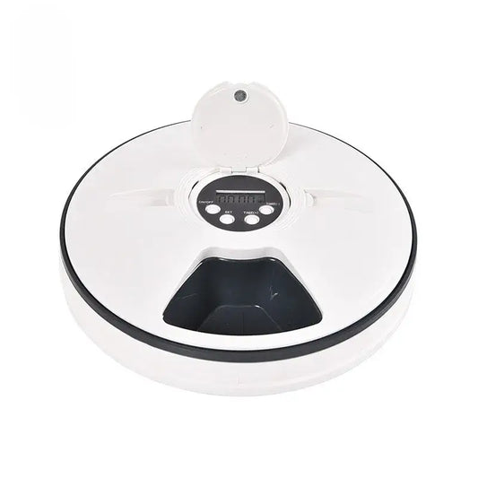 Circular automatic pet feeder with a digital display and food compartments.