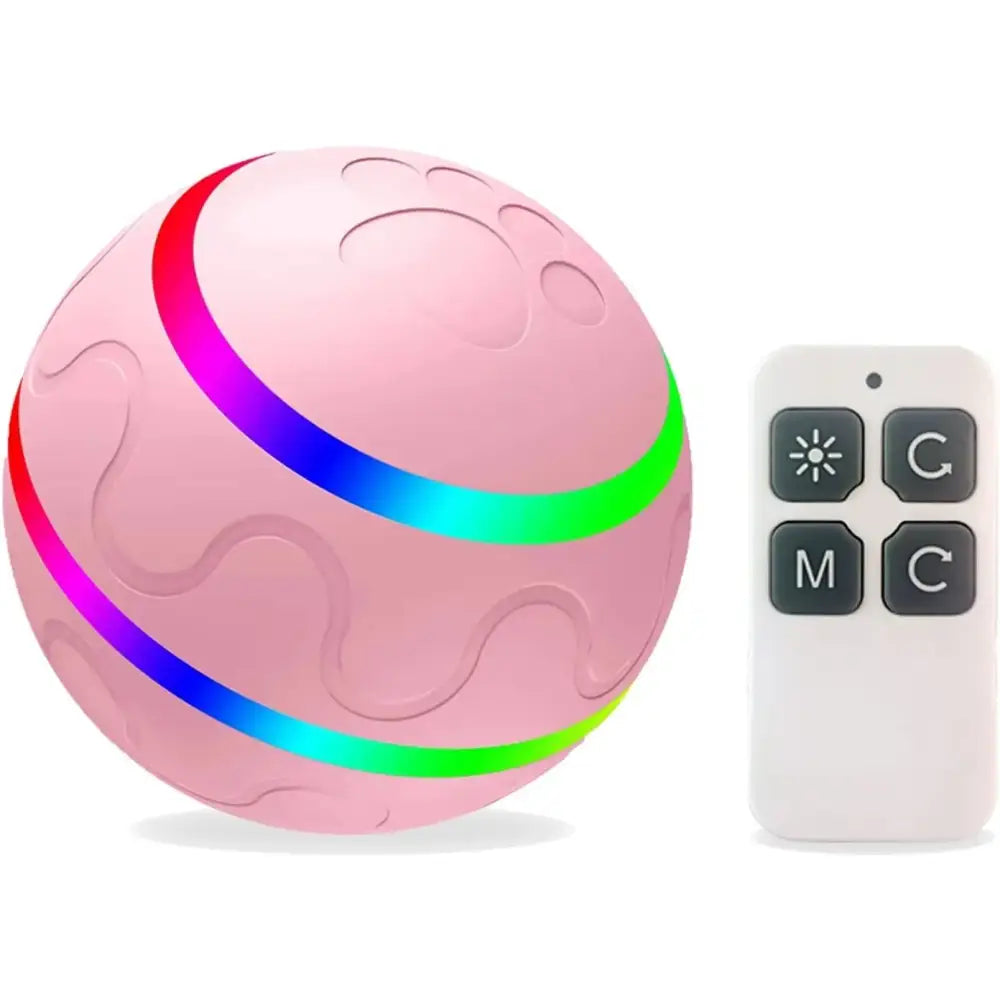 Pink spherical ball with colorful glowing bands encircling it, accompanied by a small remote control.