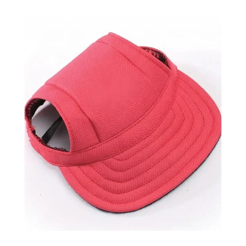 Red baseball-style cap with an open top designed for a dog.