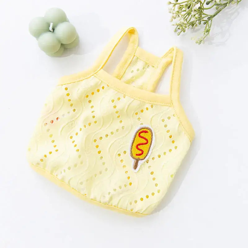 Yellow knitted or crocheted baby tank top with a popsicle design.