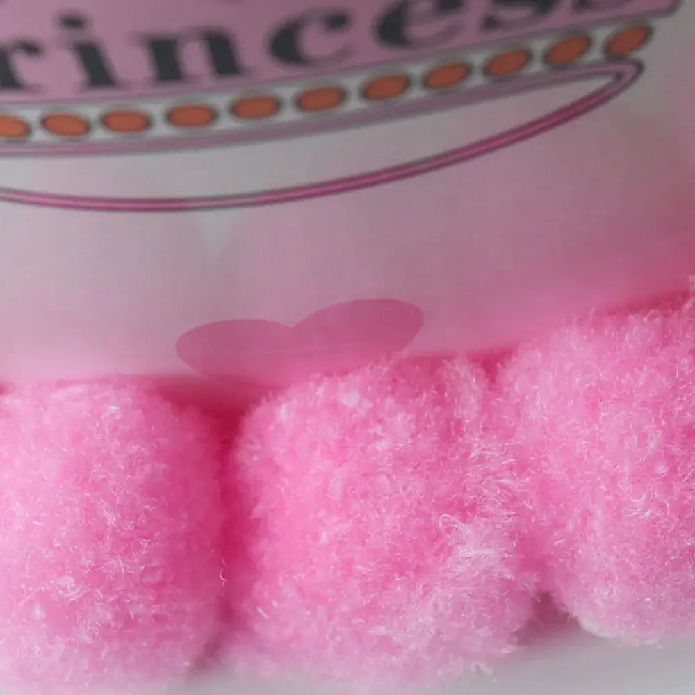 Pink cotton candy in a glass container.