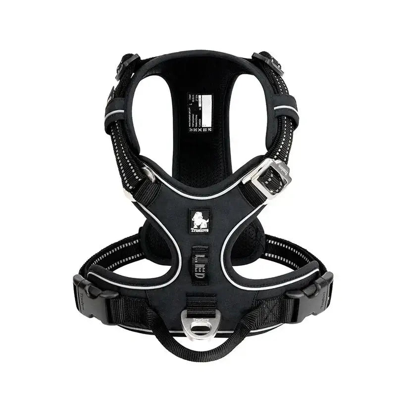 Black and silver dog harness with adjustable straps and buckles.