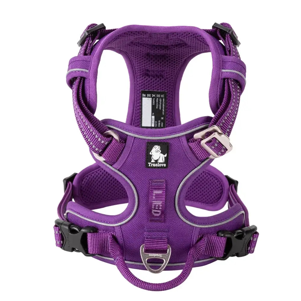 Purple dog harness with adjustable straps and reflective trim.