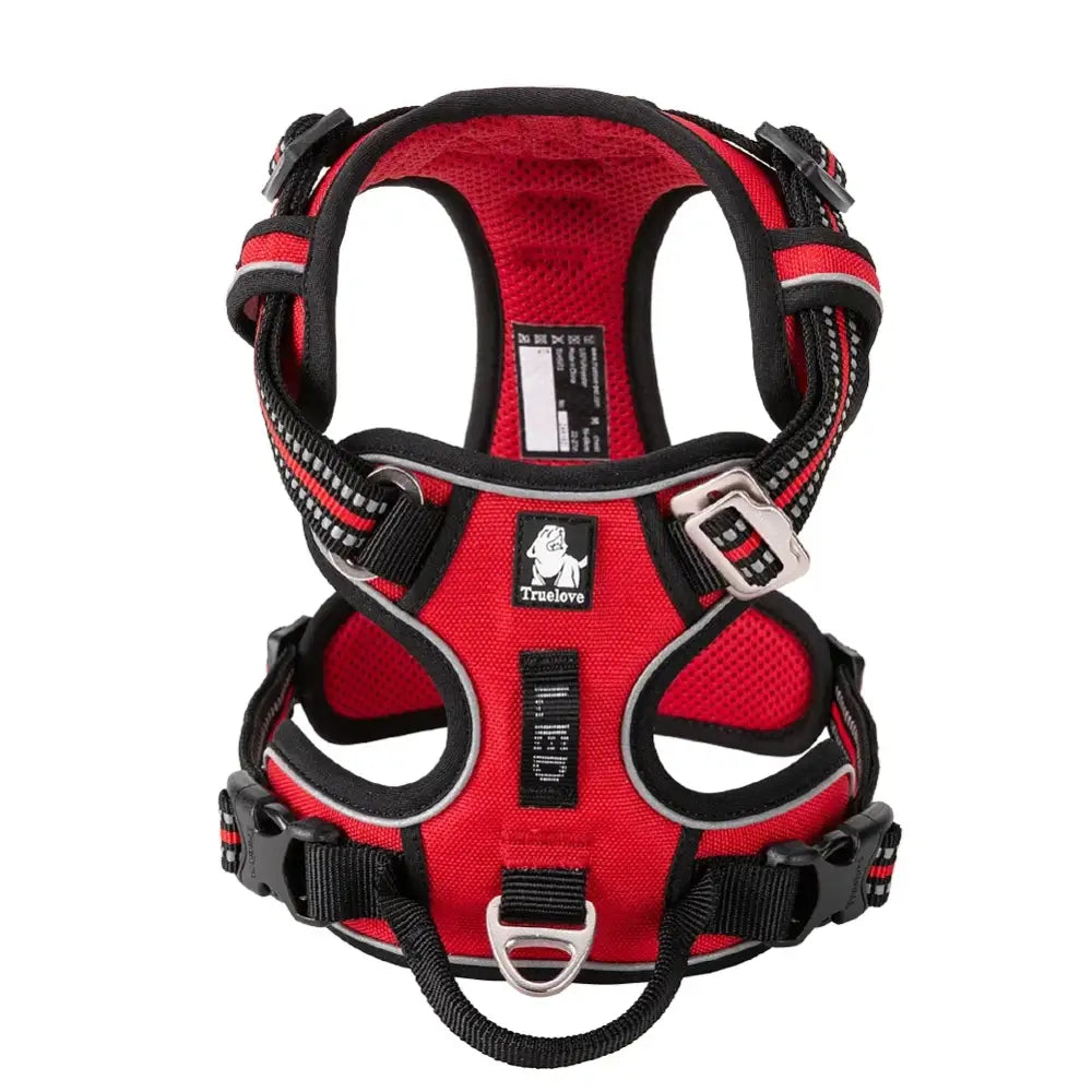 Red and black padded dog harness with multiple straps and adjustment points.