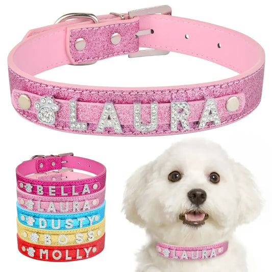 Pink glittery dog collar with personalized rhinestone letters spelling ’LAURA’.