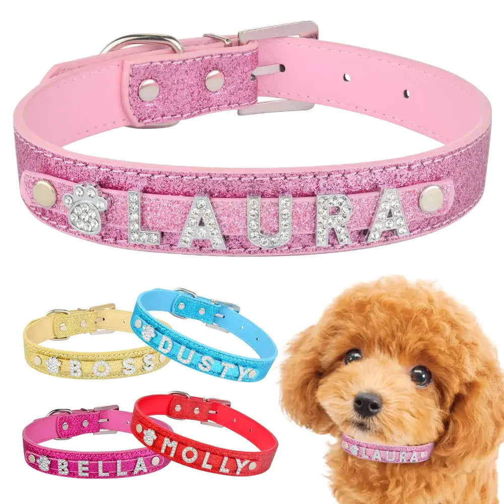 Pink leather dog collar with glittery personalized name ’LAURA’ spelled out in silver letters.