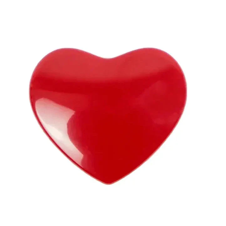 Glossy red heart-shaped object.