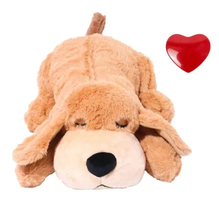 Plush stuffed animal dog lying flat with floppy ears and closed eyes.