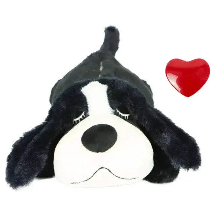 Plush toy of a black and white dog’s face with floppy ears.