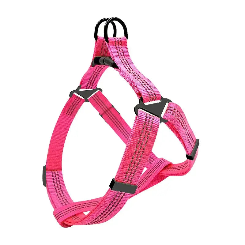 Bright pink adjustable dog harness with black trim and buckles.