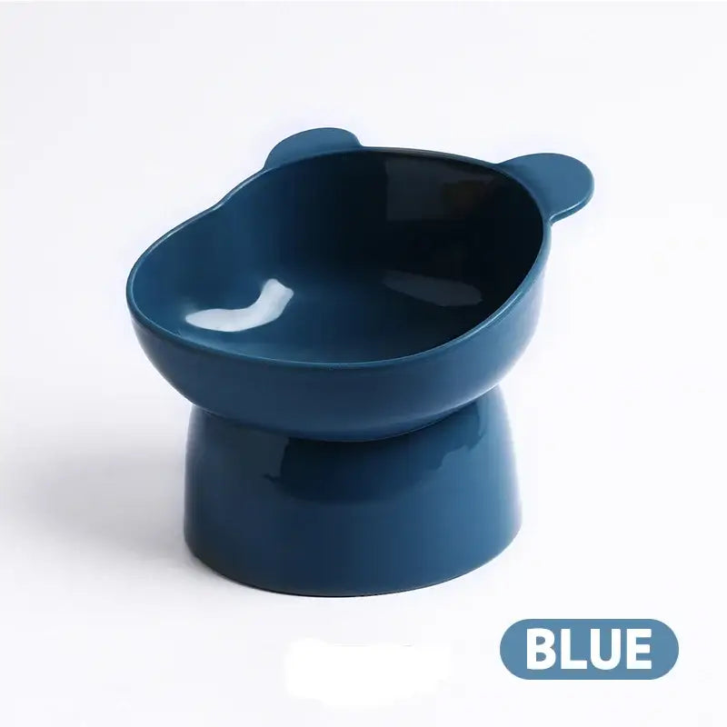 Blue elevated pet food bowl with a curved, ear-like shape.