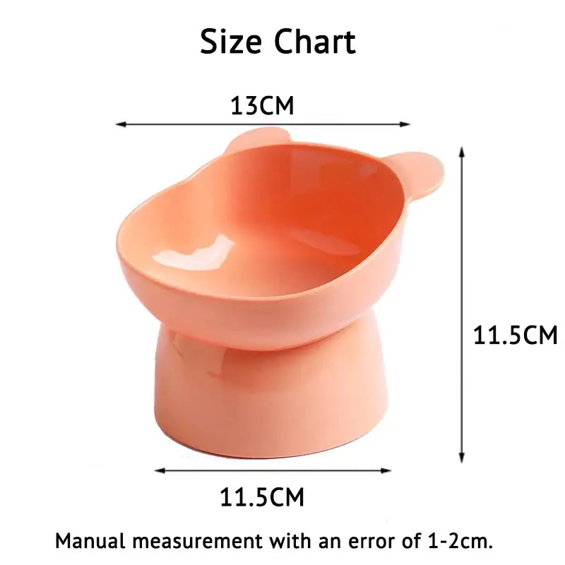 Peach-colored elevated pet bowl with a slanted design.