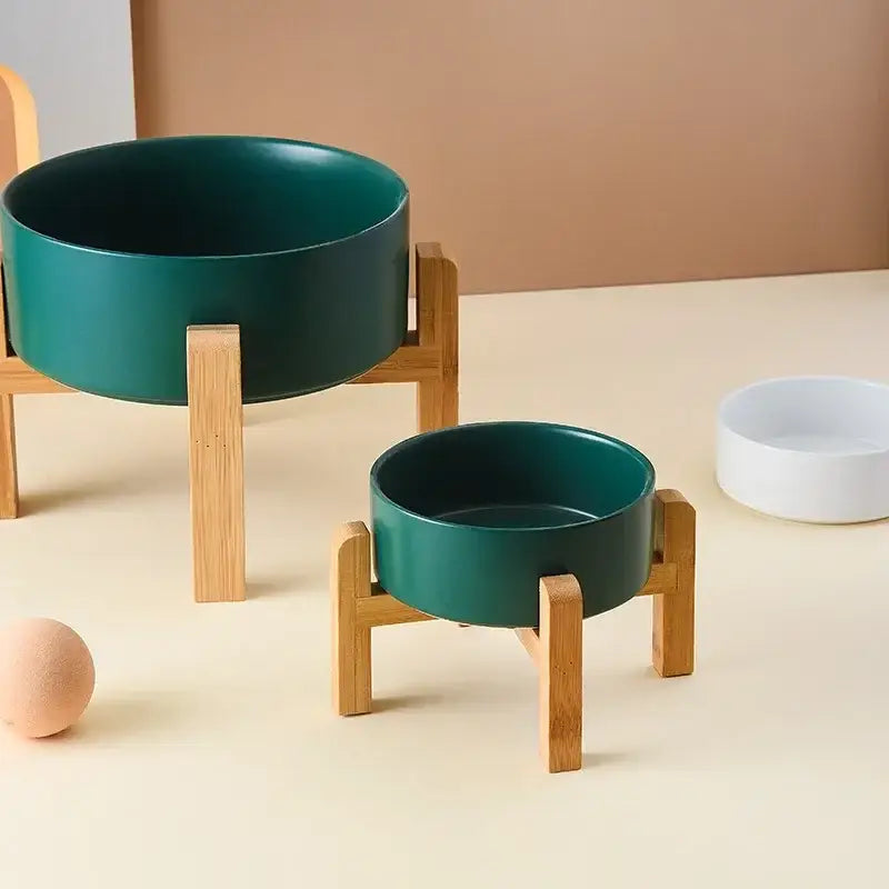 Green bowls on wooden stands.