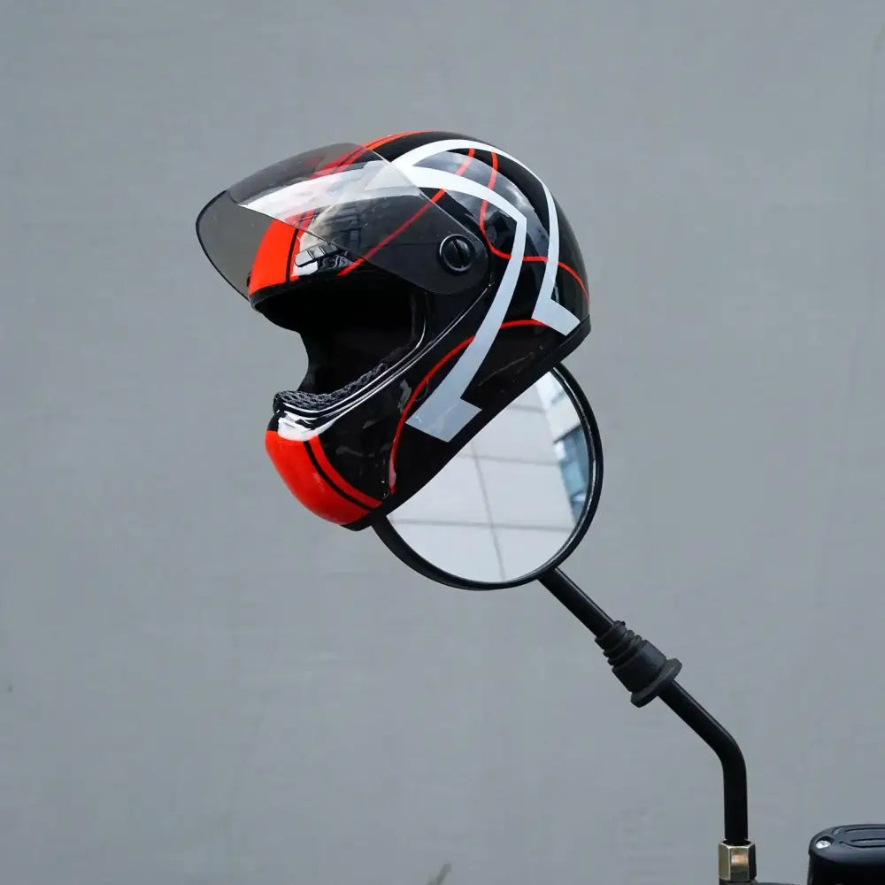 Motorcycle helmet balanced on a side-view mirror.