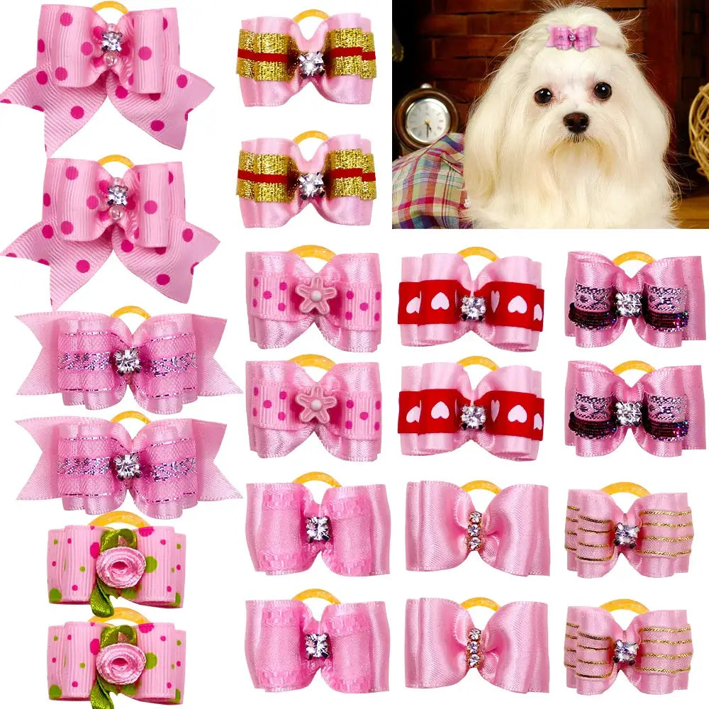 Collection of decorative pink and red hair bows with cartoon character embellishments.