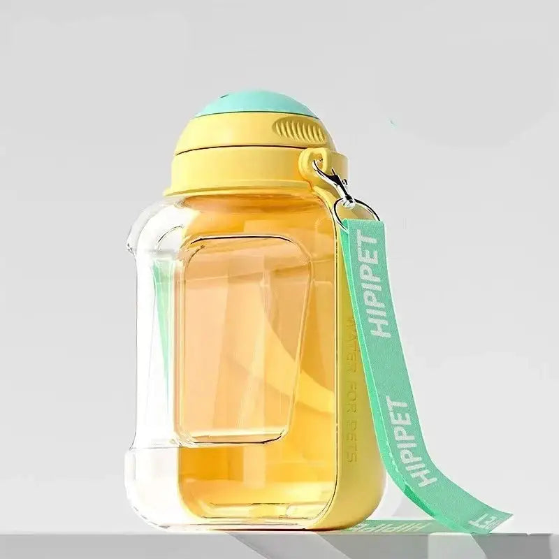 Glass jar with a yellow lid and a mint green ribbon attached.