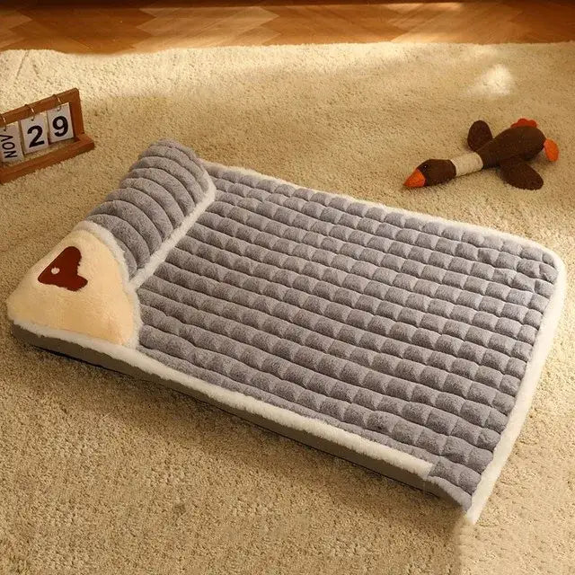 Plush dog bed with a ribbed texture and a raised pillow section.