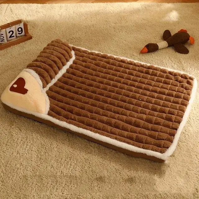 Plush dog bed shaped like a chocolate bar with a heart design.