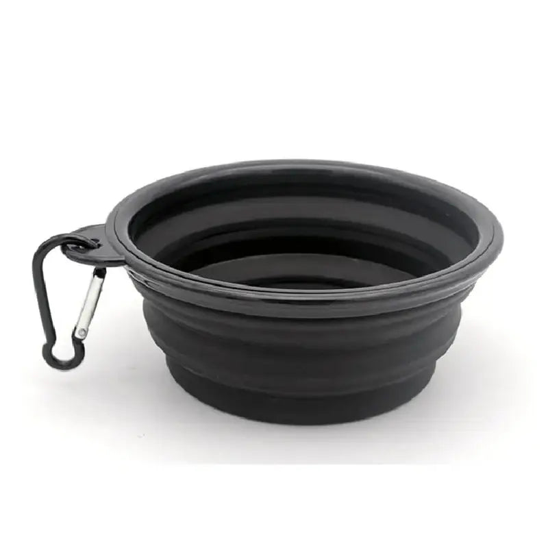 Collapsible black silicone pet bowl with attached carabiner clip.