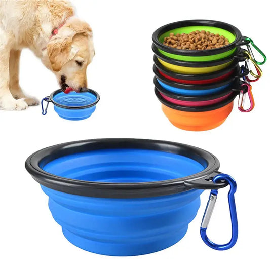 Collapsible silicone pet bowl with a carabiner clip attached.