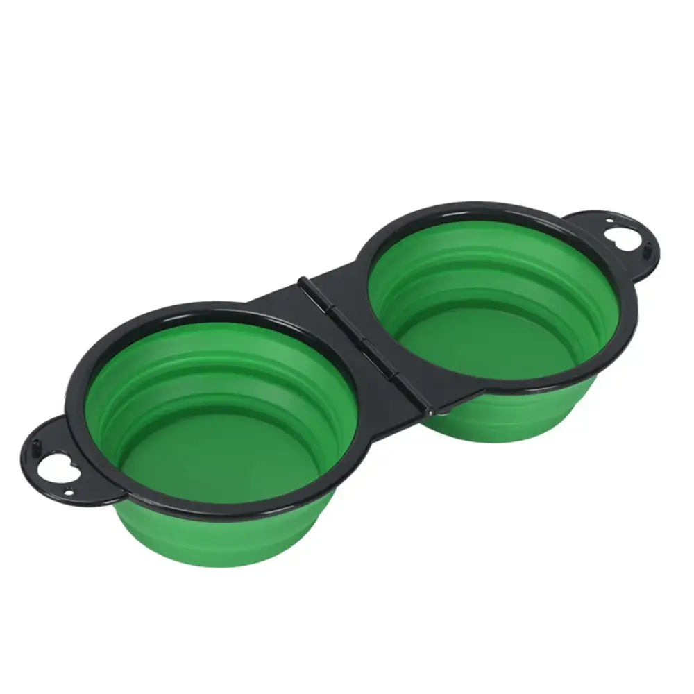 Collapsible green silicone pet bowls connected by a black hinge.