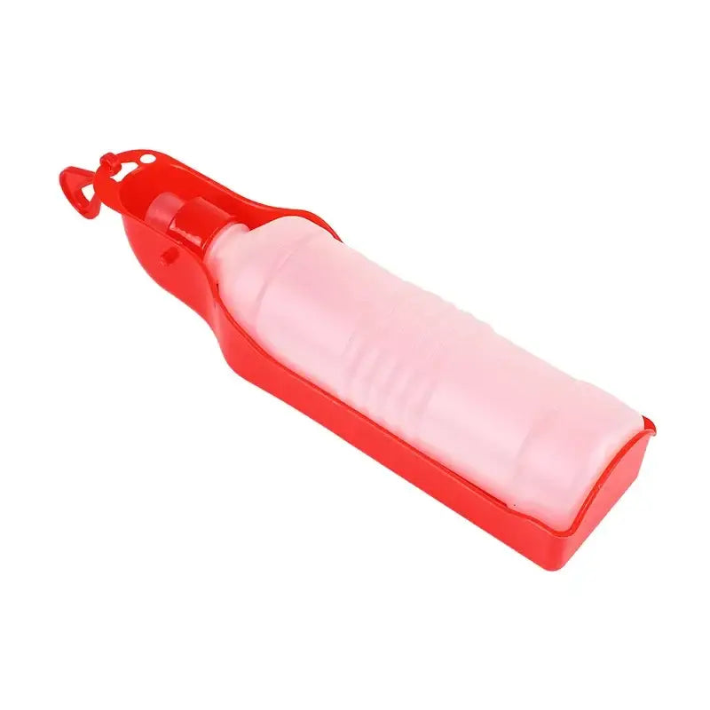 Portable water bottle for pets with a built-in drinking tray.