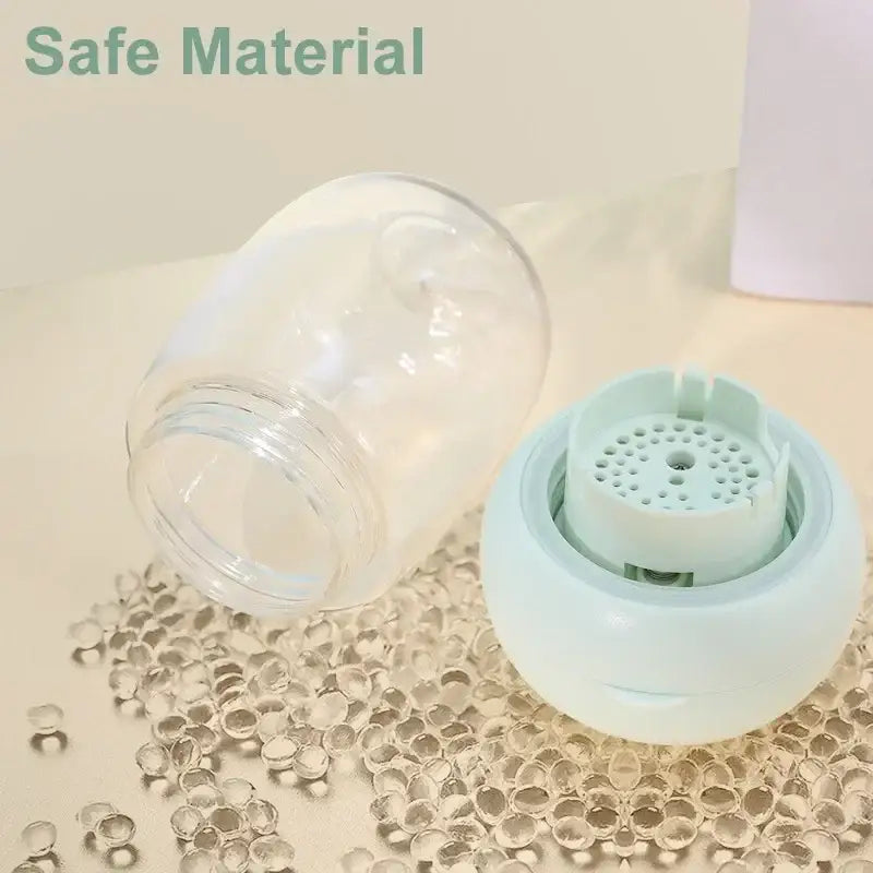 Clear glass jar or container with a light blue plastic lid containing small holes.