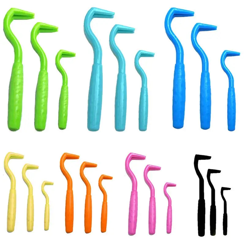 Colorful interdental brushes arranged in rows by hue.