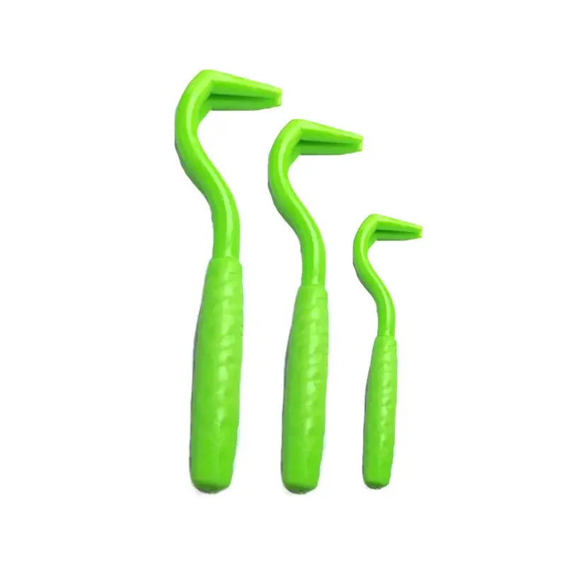 Set of three bright green interdental brushes with curved handles.