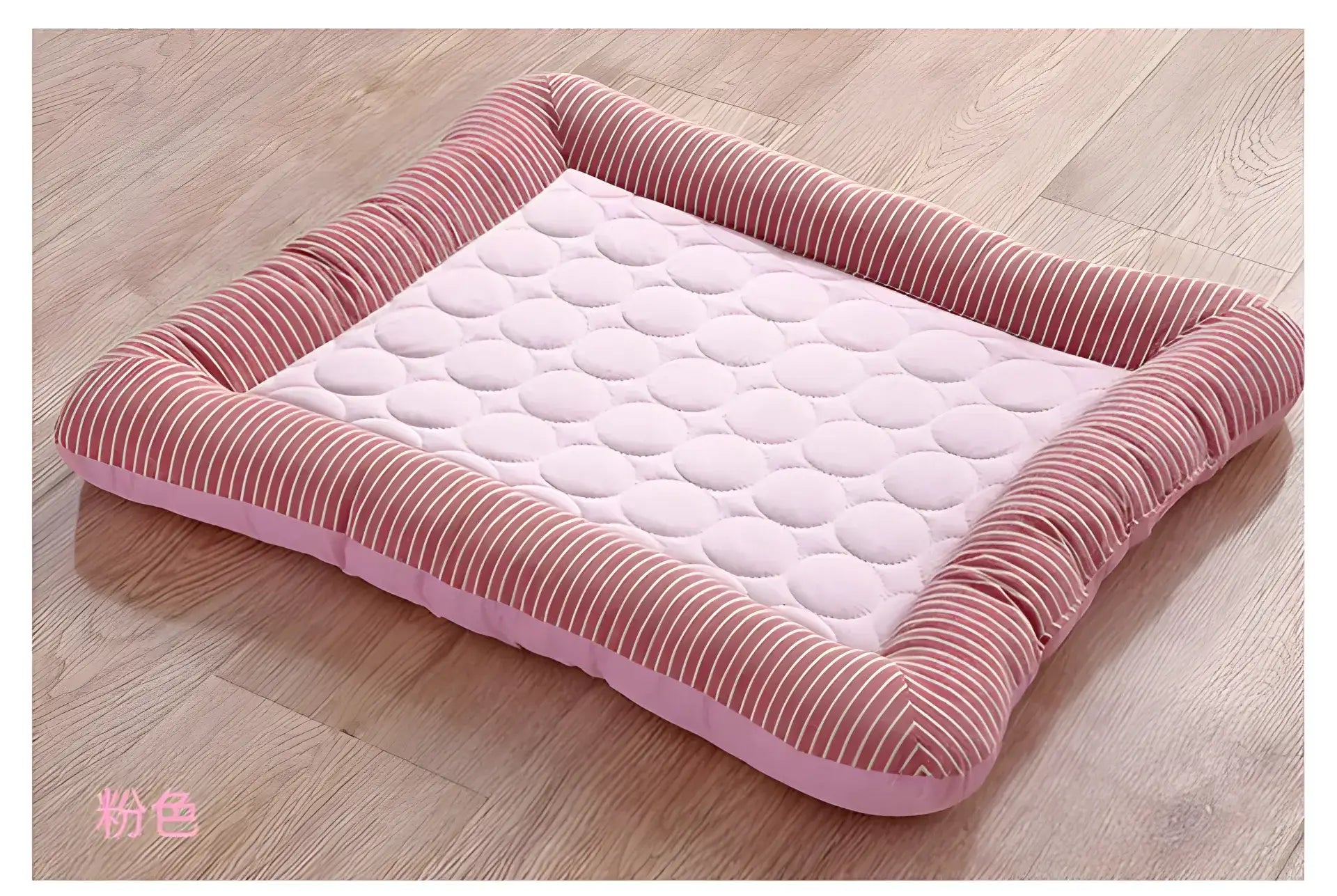 Pink rectangular pet bed with a quilted center and corduroy-textured border.