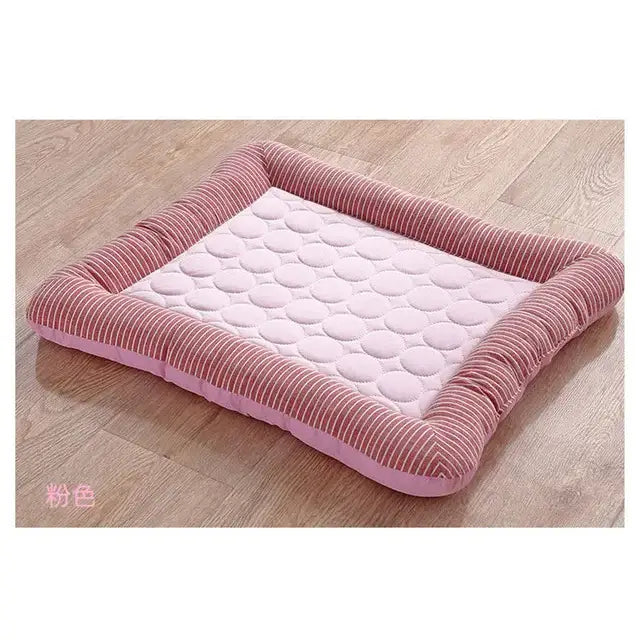 Pink rectangular pet bed with a quilted center and corduroy-textured border.