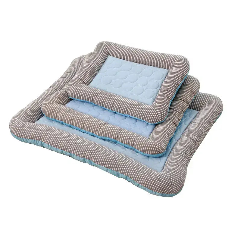 Set of three rectangular pet beds with corduroy borders and quilted blue centers.