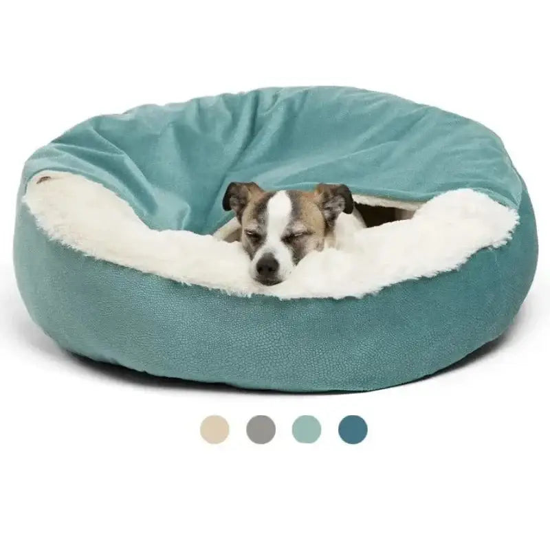 Circular pet bed with a teal exterior and plush white interior, containing a small dog.