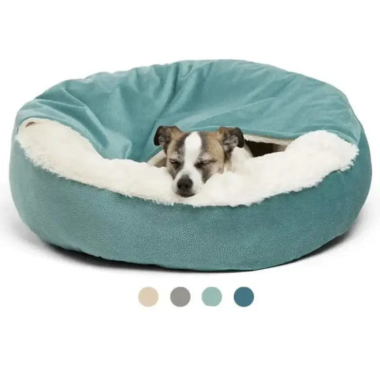 Circular pet bed with a teal exterior and plush white interior, containing a small dog.