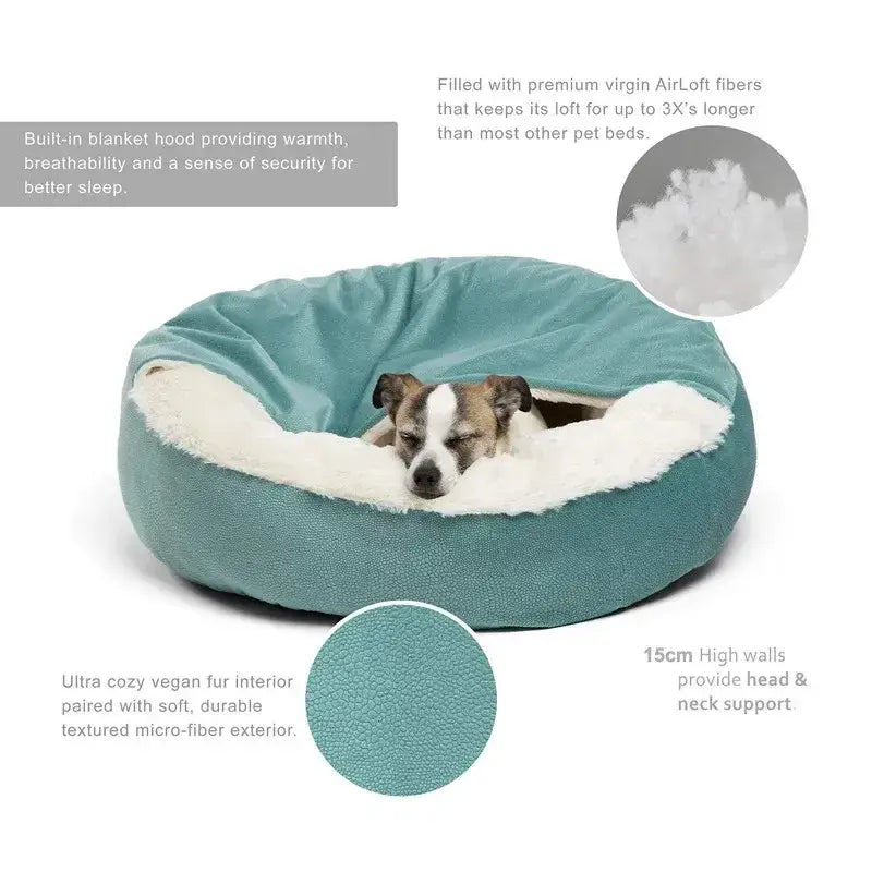 Circular teal pet bed with white fluffy interior containing a small dog.