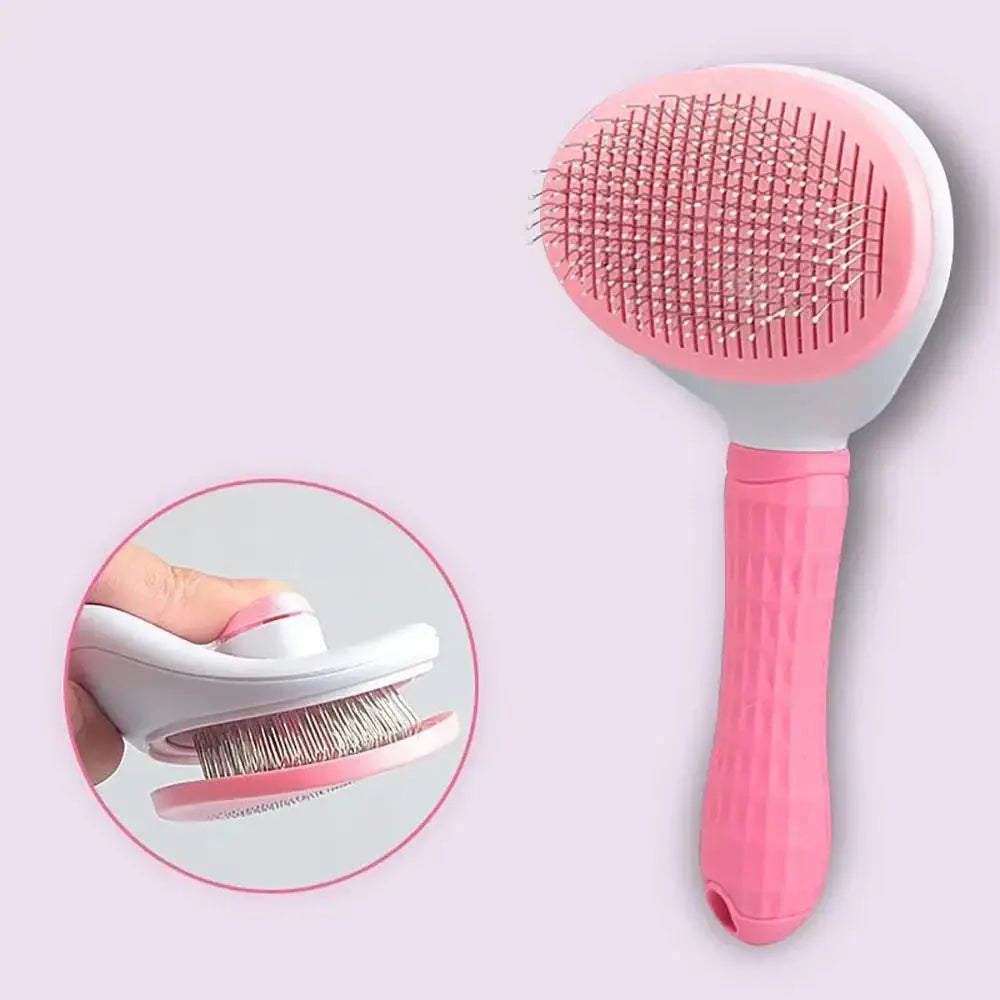 Pink pet grooming brush with a curved handle and dense bristles.