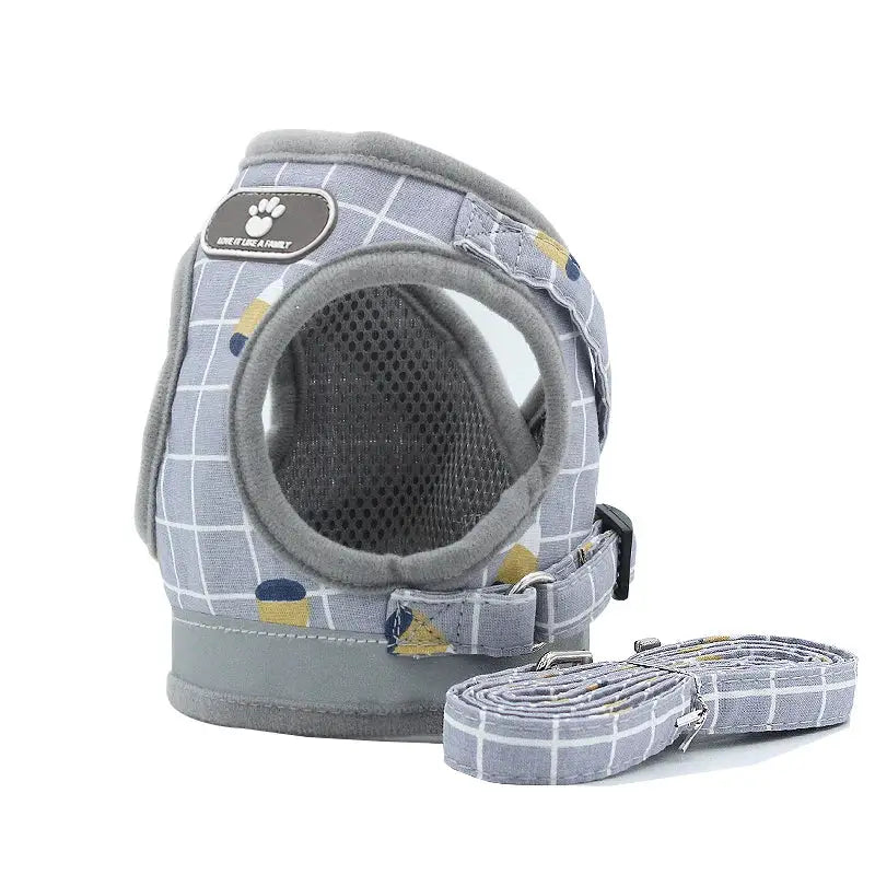 Pet carrier harness with a circular window and matching leash in a gray plaid pattern.