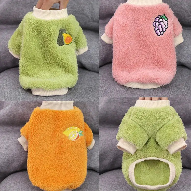 Fluffy pet sweaters in various bright colors with fruit designs.