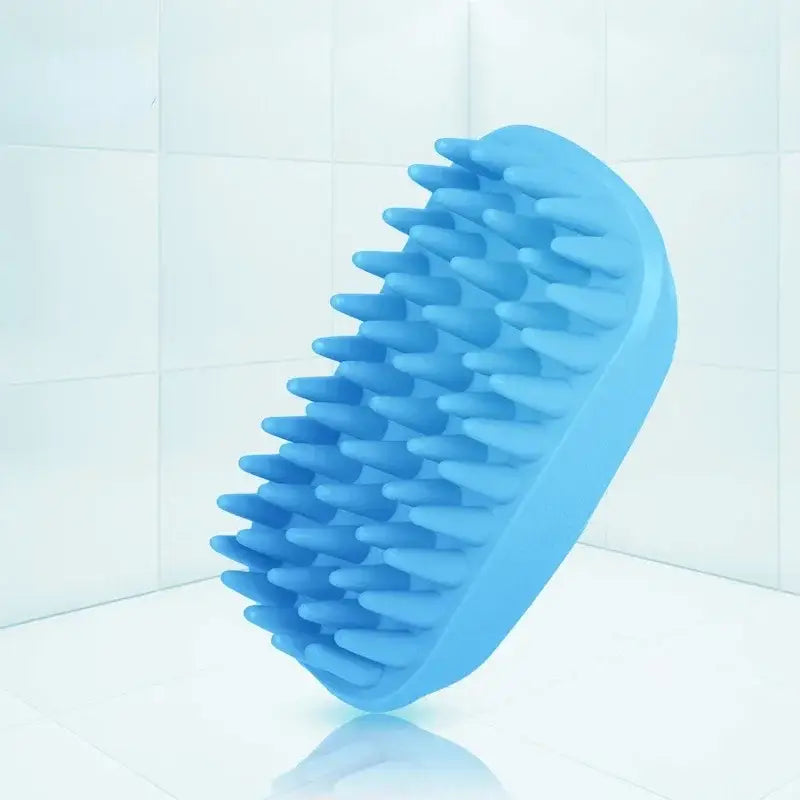 Blue silicone brush with soft, flexible bristles for gentle scrubbing or massaging.